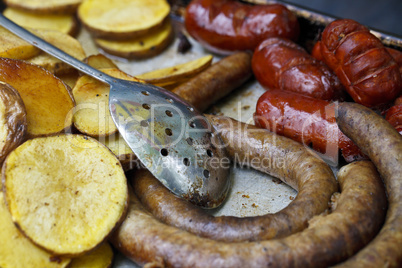 fried potatoes and sausages