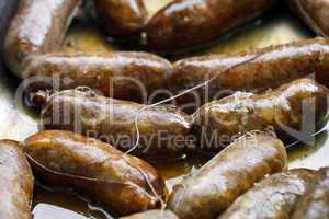 beautiful delicious sausages on charcoal