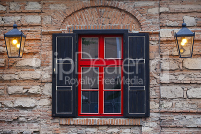 facade of the building ,  window a red- black