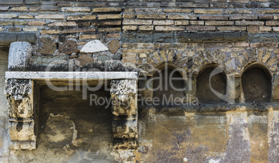 Old wall with bricks and archs