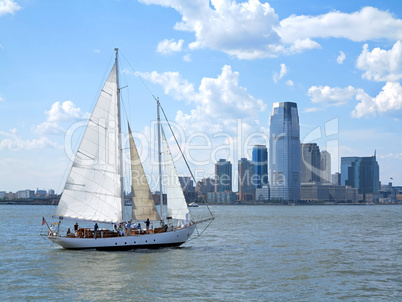 City and a Sail Boat