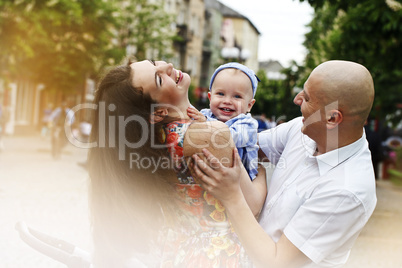 Beautiful happy young family with baby