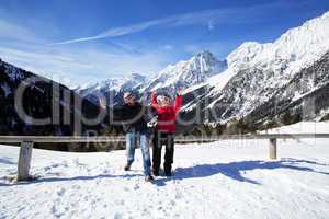 Happy couple in winter landscape
