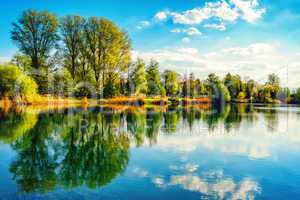 Tranquil lakeshore landscape with blue sky and water