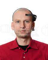 Portrait of young man with EEG (electroencephalography) headset