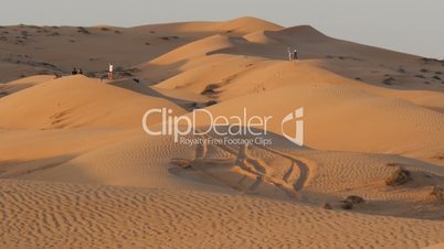 tourists in oman desert