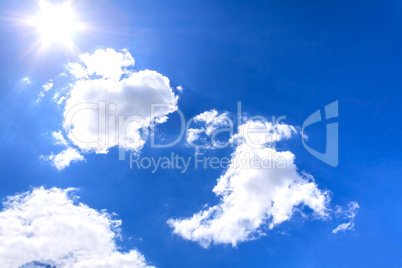Clouds and sun on blue sky