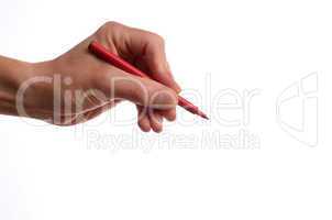 Hand with a red pen