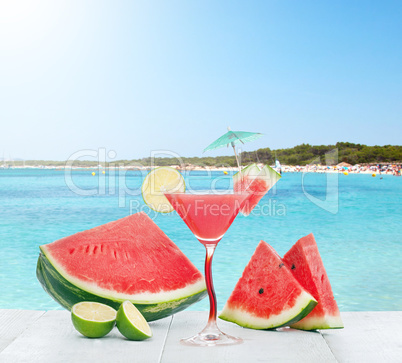 Drink of watermelon juice with lime slice.