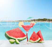 Drink of watermelon juice with lime slice.