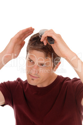 Man brushing his hair.