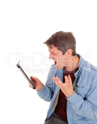 Man shouting on his tablet.