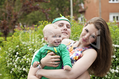 Beautiful happy young family with baby