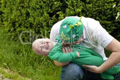 Happy father playing with his son