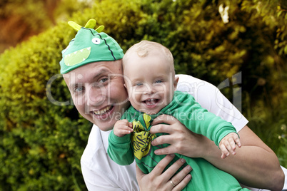 Happy father playing with his son