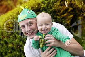 Happy father playing with his son