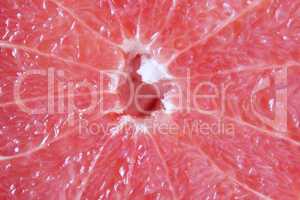cut fruit of red grapefruit on the board