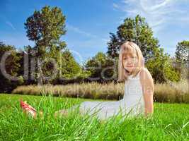 girl sitting on grass