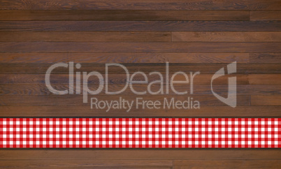 Holzhintergrund mit Tischdecke in rot und weiss