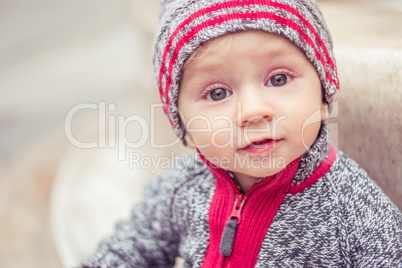 happy little baby boy wearing hat