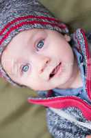 happy little baby boy wearing hat