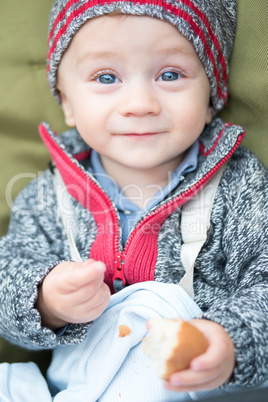 happy little baby boy wearing hat