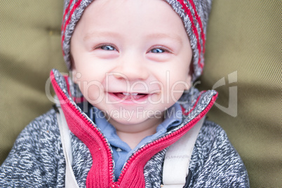 happy little baby boy wearing hat