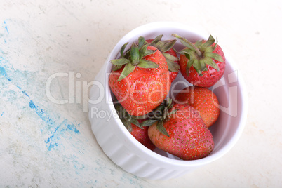 Close up strawberry on old watercolor plate