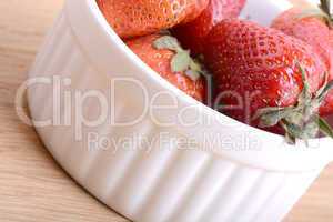 Close up strawberry on wooden plate