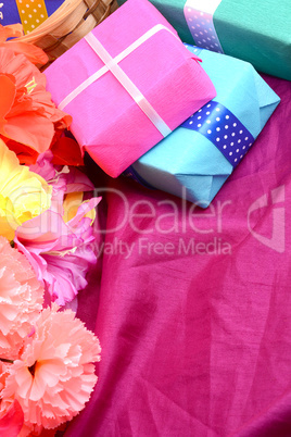 present gift box and flower bouquet on silk