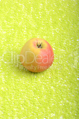 fresh apple on green background