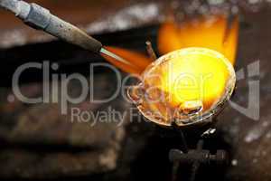 Melting silver in a jewelry workshop