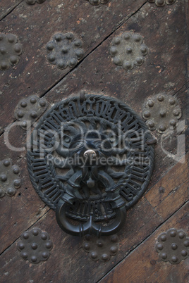 middle ages door bell on massive wooden door