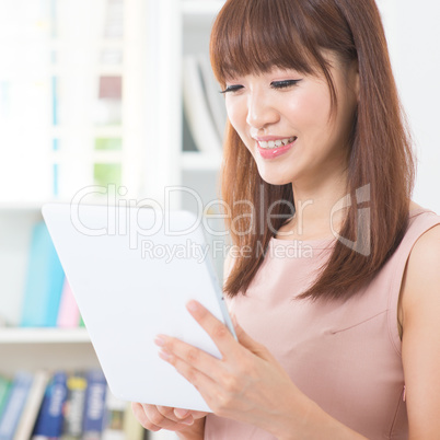 Asian girl using tablet