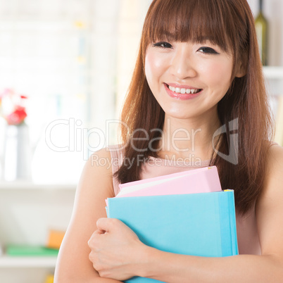 Asian girl with textbooks