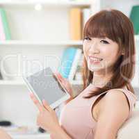 Asian girl using touch screen tablet