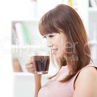 Asian girl drinking coffee