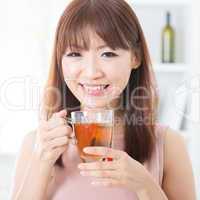 Asian girl enjoying tea
