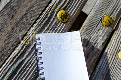 Blank Note Book on Wooden Background