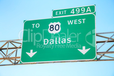 Road sign with the direction to Dallas