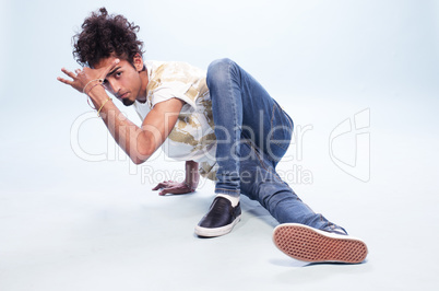 Male Dancer in a Hip Hop Pose on the Floor