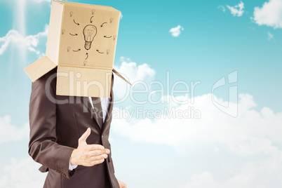 Composite image of anonymous businessman offering his hand