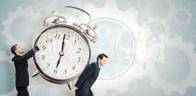 Composite image of businessman with arms raised catching somethi