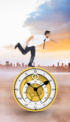 Composite image of geeky young businessman running late