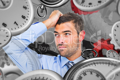 Composite image of businessman thinking his hand up