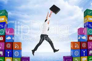 Composite image of businessman leaping with his briefcase