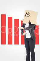 Composite image of businesswoman presenting with box over head