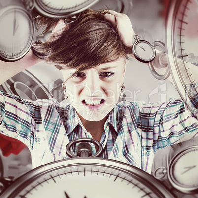 Composite image of pretty brunette shouting with hands on head