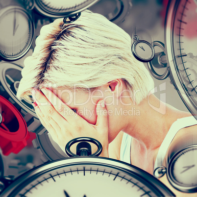 Composite image of sad blonde woman crying with head on hands