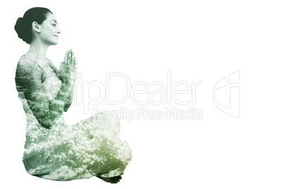 Composite image of content brunette in white sitting in lotus po